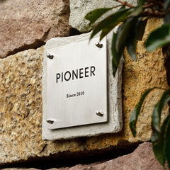 Tailored Limestone and Brass Nameplates for a Sophisticated Look