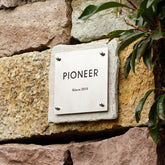 Tailored Limestone and Brass Nameplates for a Sophisticated Look
