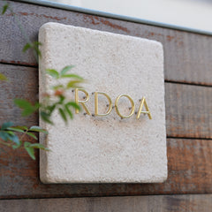 Handcrafted Excellence Customized Limestone and Brass Signs